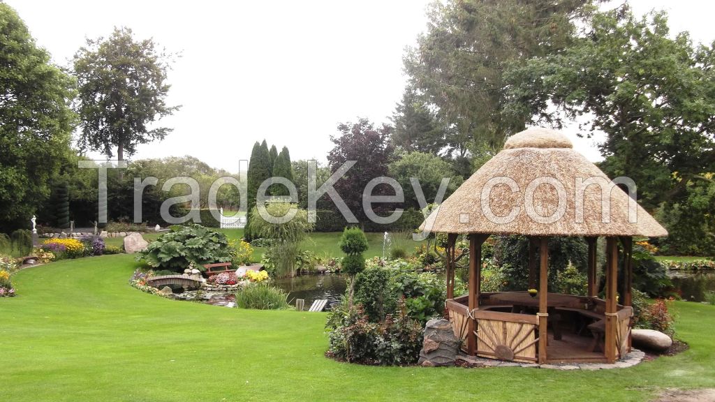 Pavilion. Gazebo with reed roof. Thatched gazebo.