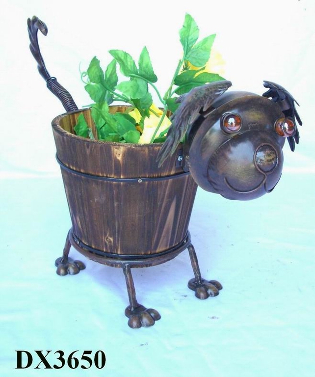 metal dog with wooden pot
