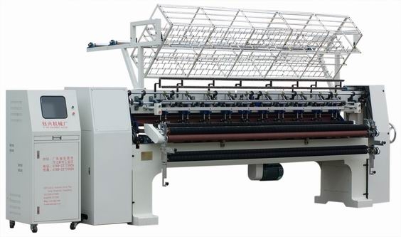 computerized shuttle multi-needle quilting machine(128)