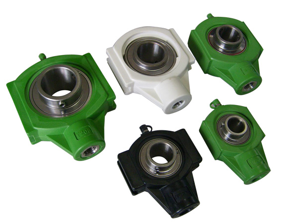 Thermoplastic housing with stainless steel bearings