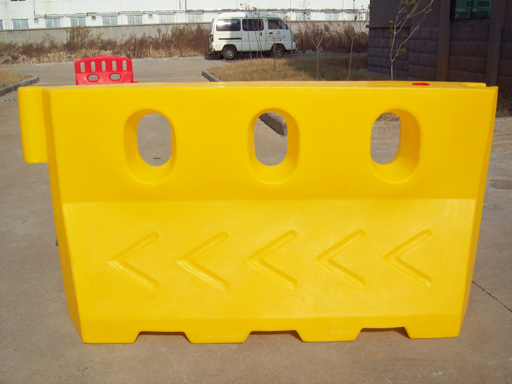 Rotational molding road barrier