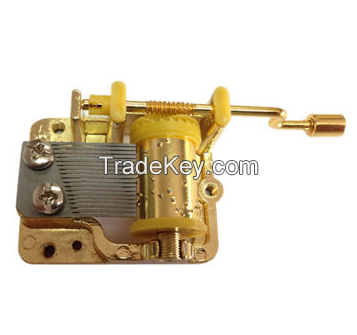 Hand crank music movement with golden color Applicable to transparent plastic box