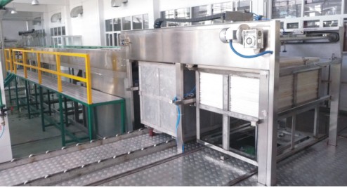 Automatic filled can cage loading machine