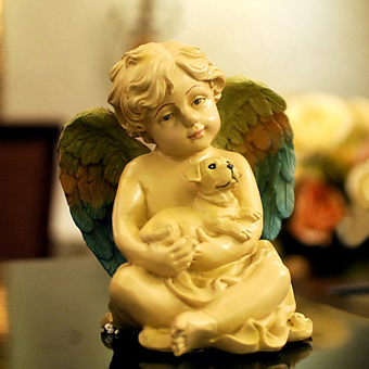 Cream colored resin cherub with dog