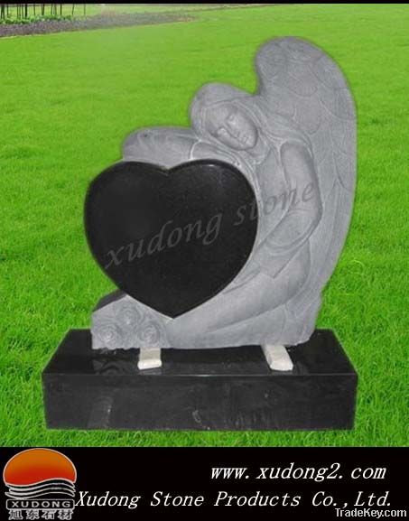 The headstone of  angle with heart