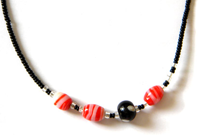 Black beaded necklace with red beads