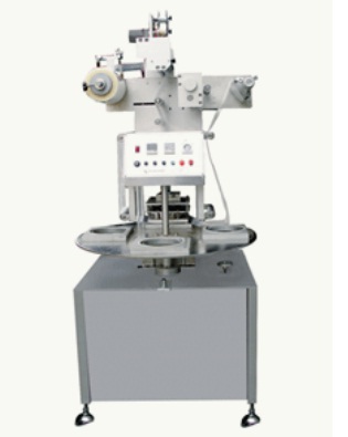 Rotary cup tray sealer