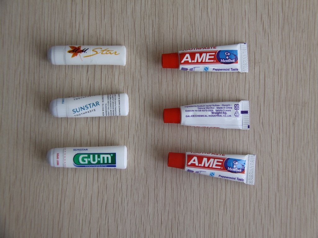 hotel toothbrush, soap, shampoo, dental kit
