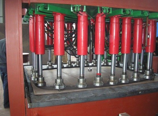 Dished end hydraulic machine