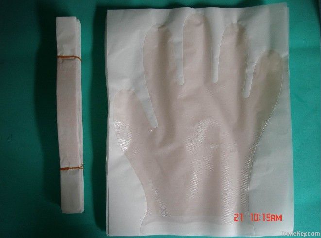 Medical glove with paper