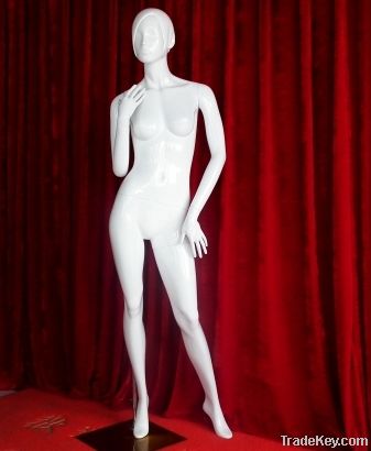 Fashion designer standing female mannequin