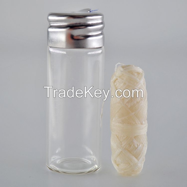 silk dental floss in glass bottle