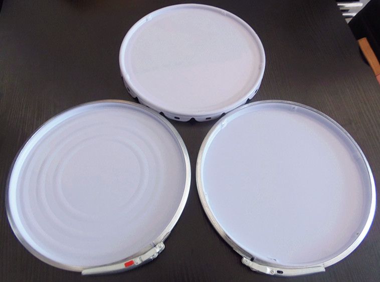 Lug lids with foam seal and coating