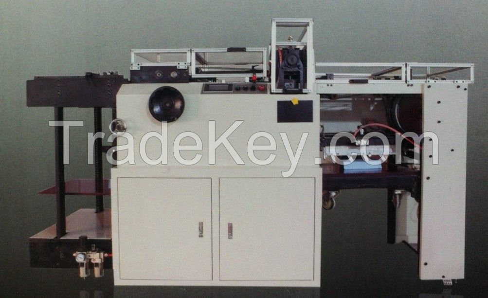 Automatic calendar and notebook punching machine
