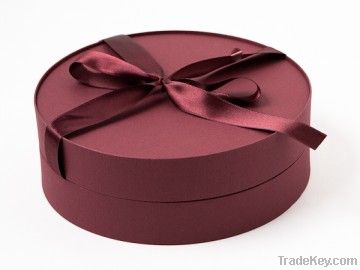 Round burgundy jewelry gift box with bow