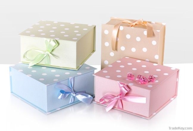 Colorful polka dot paper gift box with ribbon