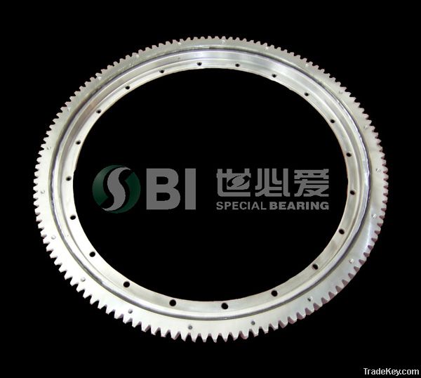 Single row four point contact ball bearing, with external gear & flange