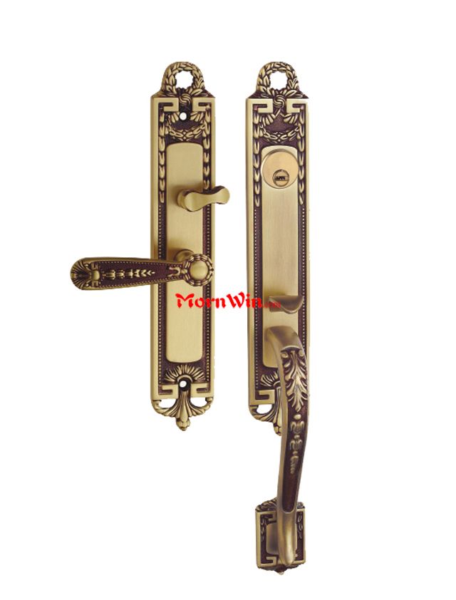 Delicate antique Bronzed Brass door handle for ancient wooden door