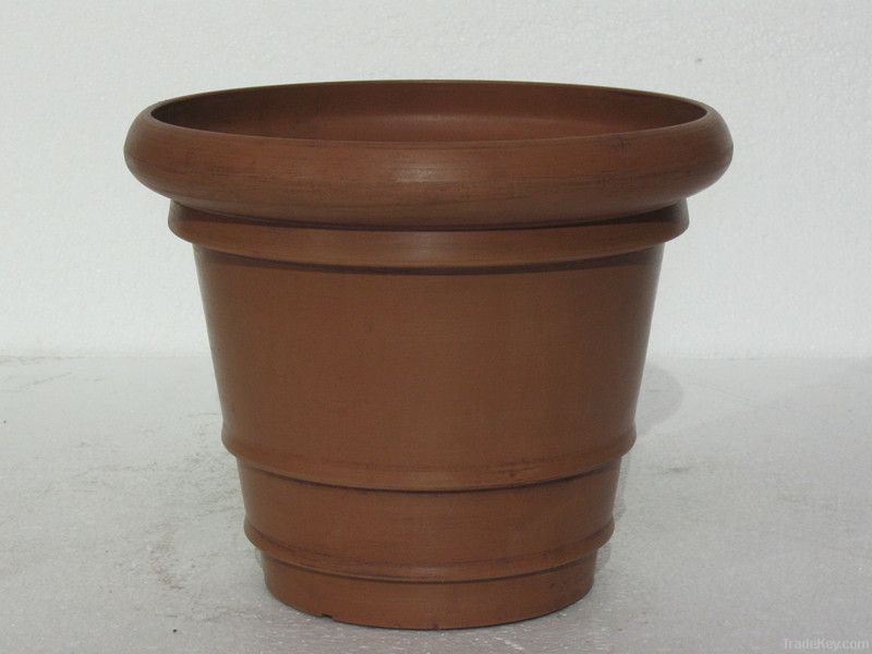 plastic, wood and stone flower pot