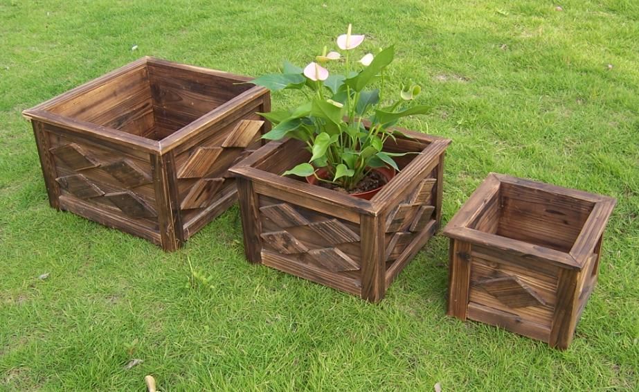 wooden planter/barrel with different designs