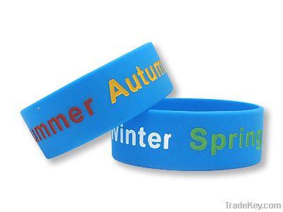 Deboosed color filled silicone wristband