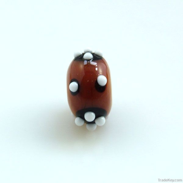 lampwork glass amber bead with white dots