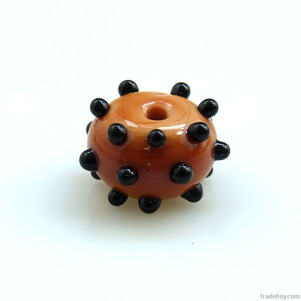 lampwork glass amber bead with black dots