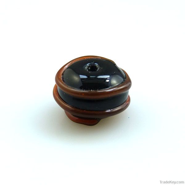 lampwork glass black bead with amber swirl