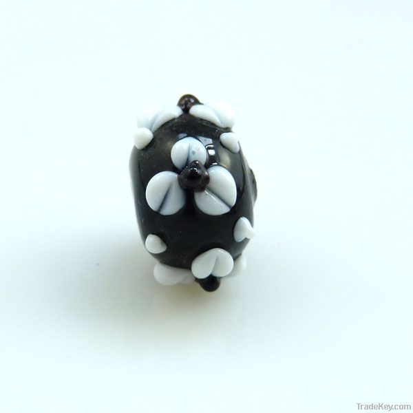 lampwork glass black roundel with white flowers