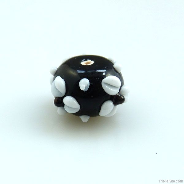 lampwork glass black roundel with white flowers