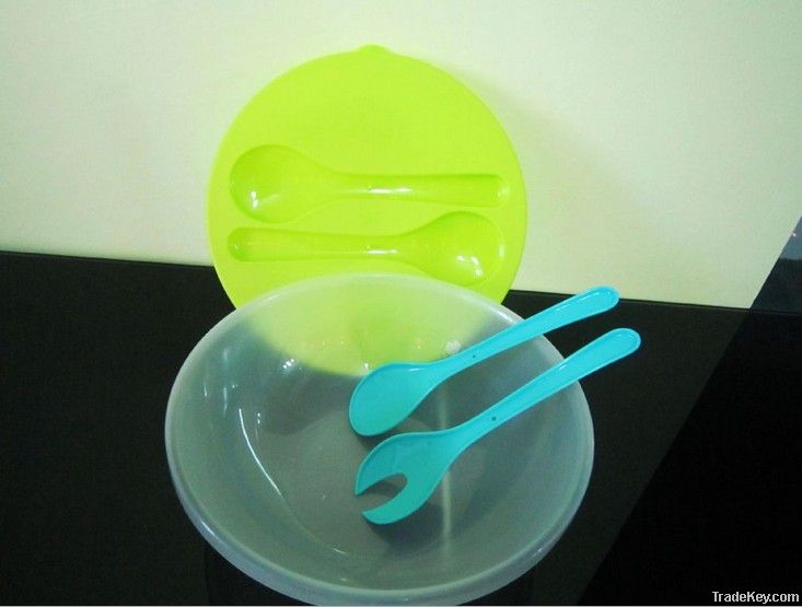 plastic salad bowl with spoon and fork