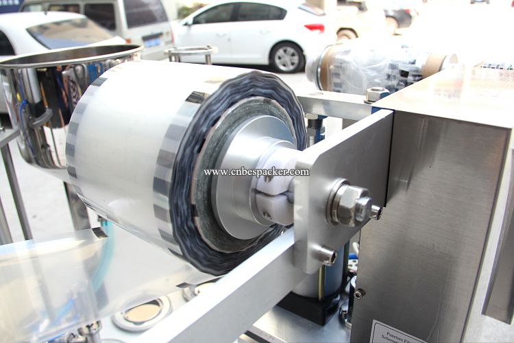 Rotary cup roll film filling and sealing machine