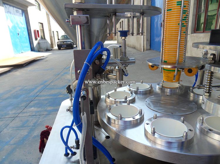 Automatic paper cup filling and sealing machine