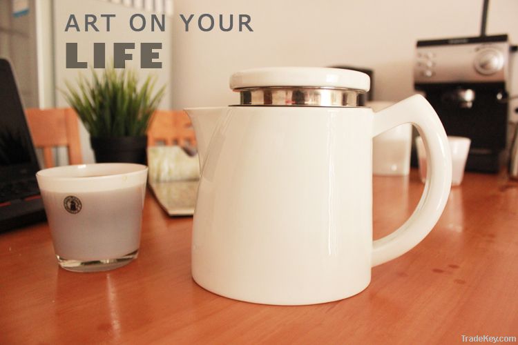 White ceramic coffee pot with stainless steel filter