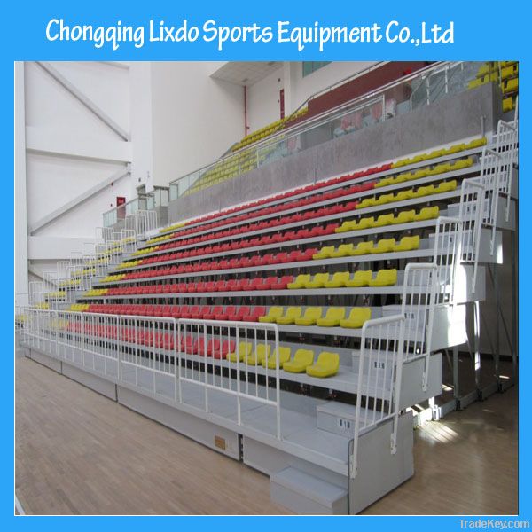 manual control retractable wooden bleacher with fold-up chair