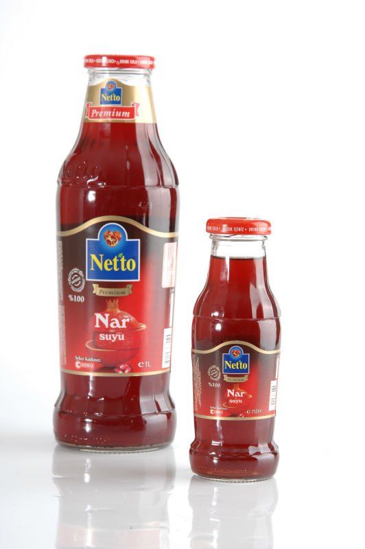 Netto Premium %100 fruit juices in glass bottle