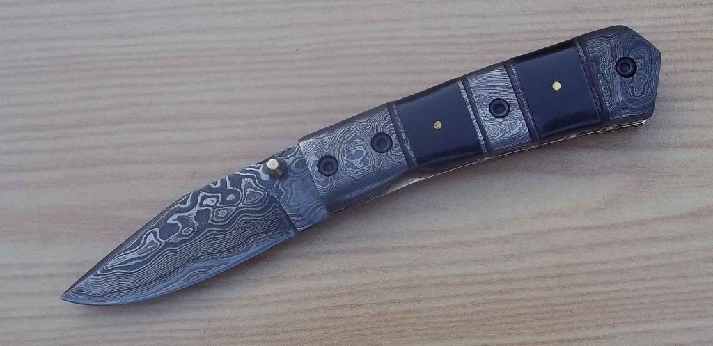 Damascus handmade knife with bolster handle