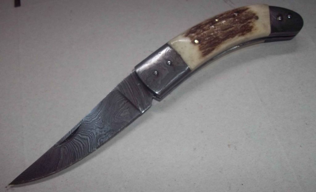 Damascus knife with deer stag handle