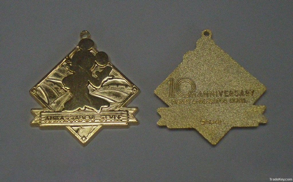 Gold-plated mickey badge