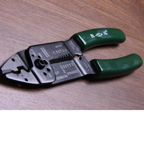 Multi-functional wire crimping stripper/pliers