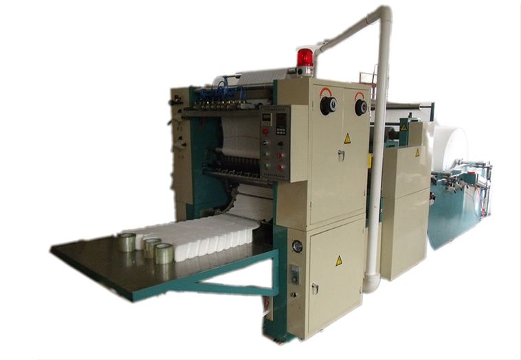 Facial tissue folding machine