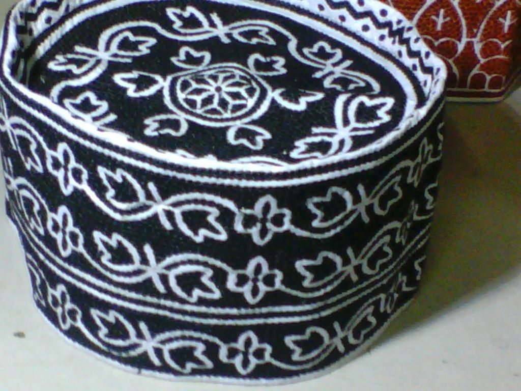 OMANI CAP                                             