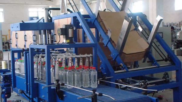 Automatic case or tray packer for bottles and soft bag milk