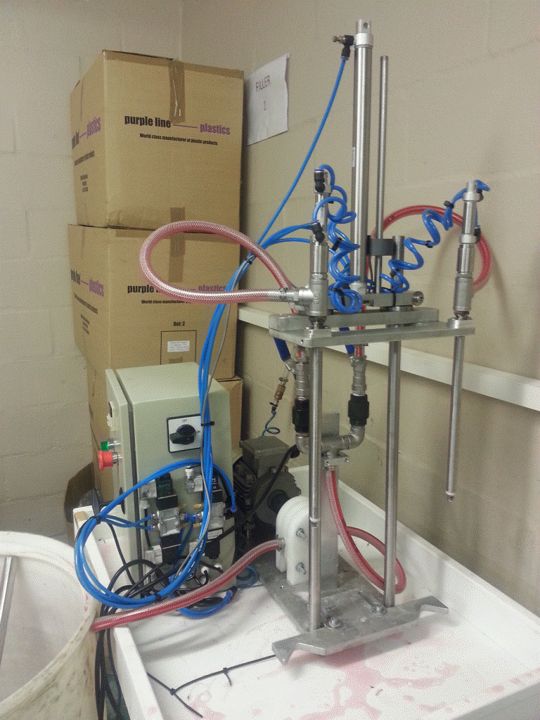 Semi-automatic double head gearfilling system