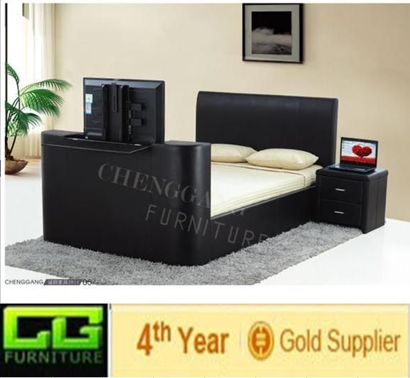 modern king size leather bed with tv in footboard