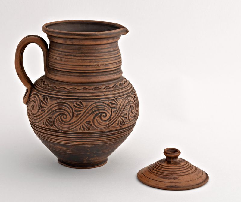 Clay jug, jar, pitcher with a lid.