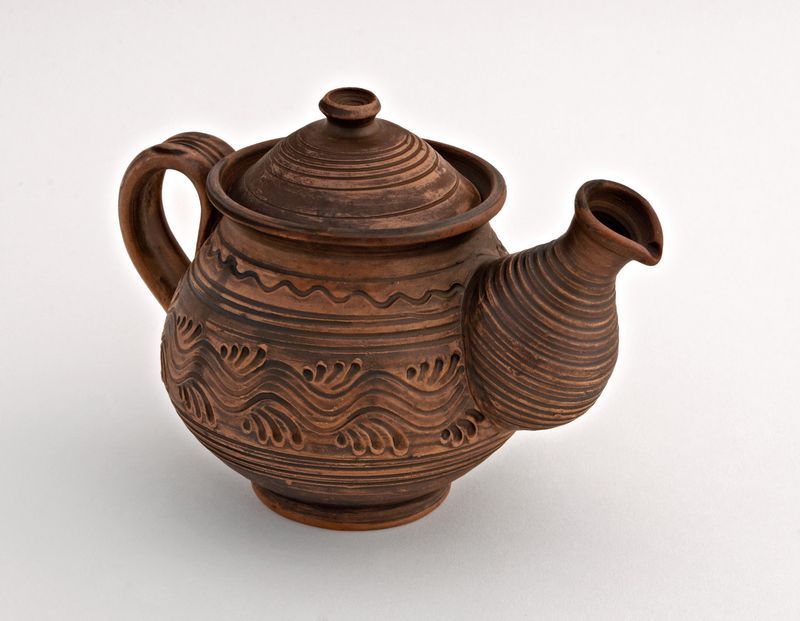 Ceramic tea pot made of red clay.