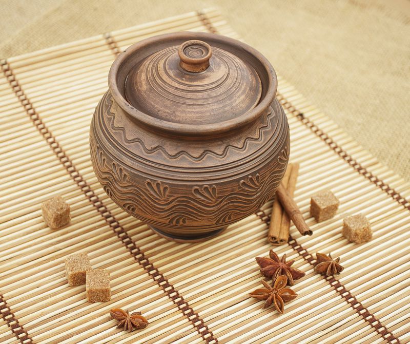 Ceramic roasting pot with a lid made by hands.