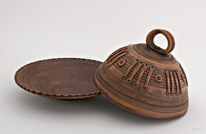 Ceramic dish with lid made of red clay.