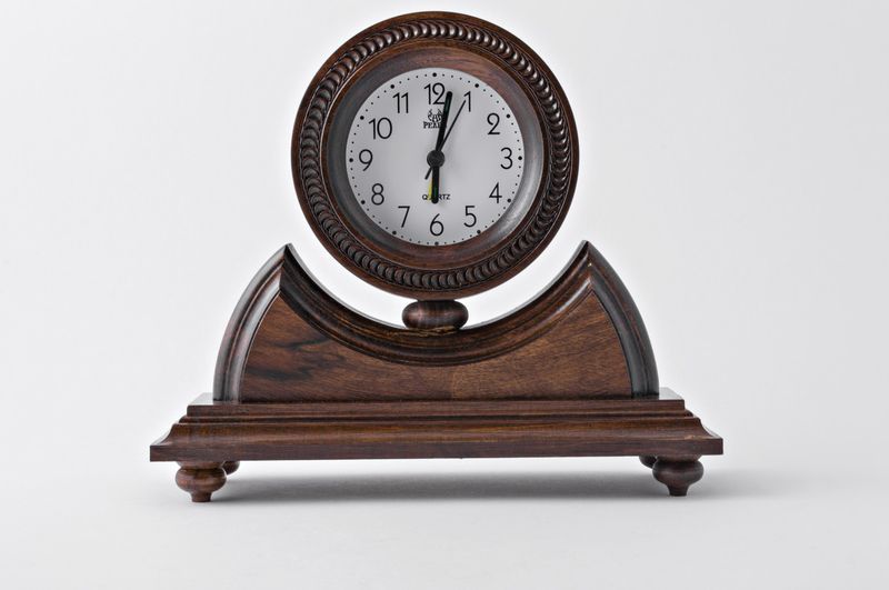 Desk wooden alarm clock with hand carved pattern.